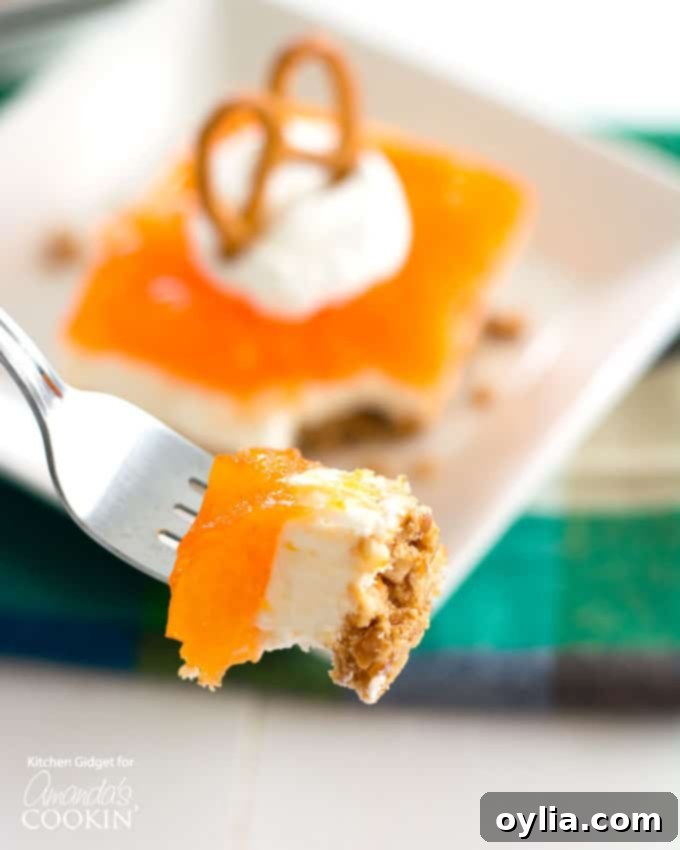 Mandarin Orange Pretzel Salad one-pan dessert recipe! A perfect treat for any occasion.