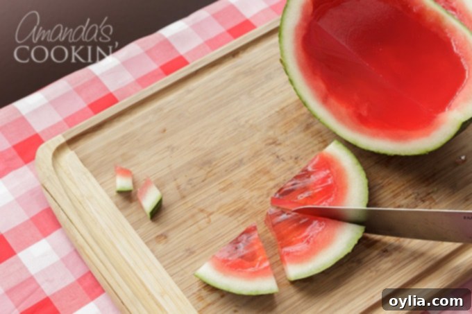 slicing watermelon jello shots