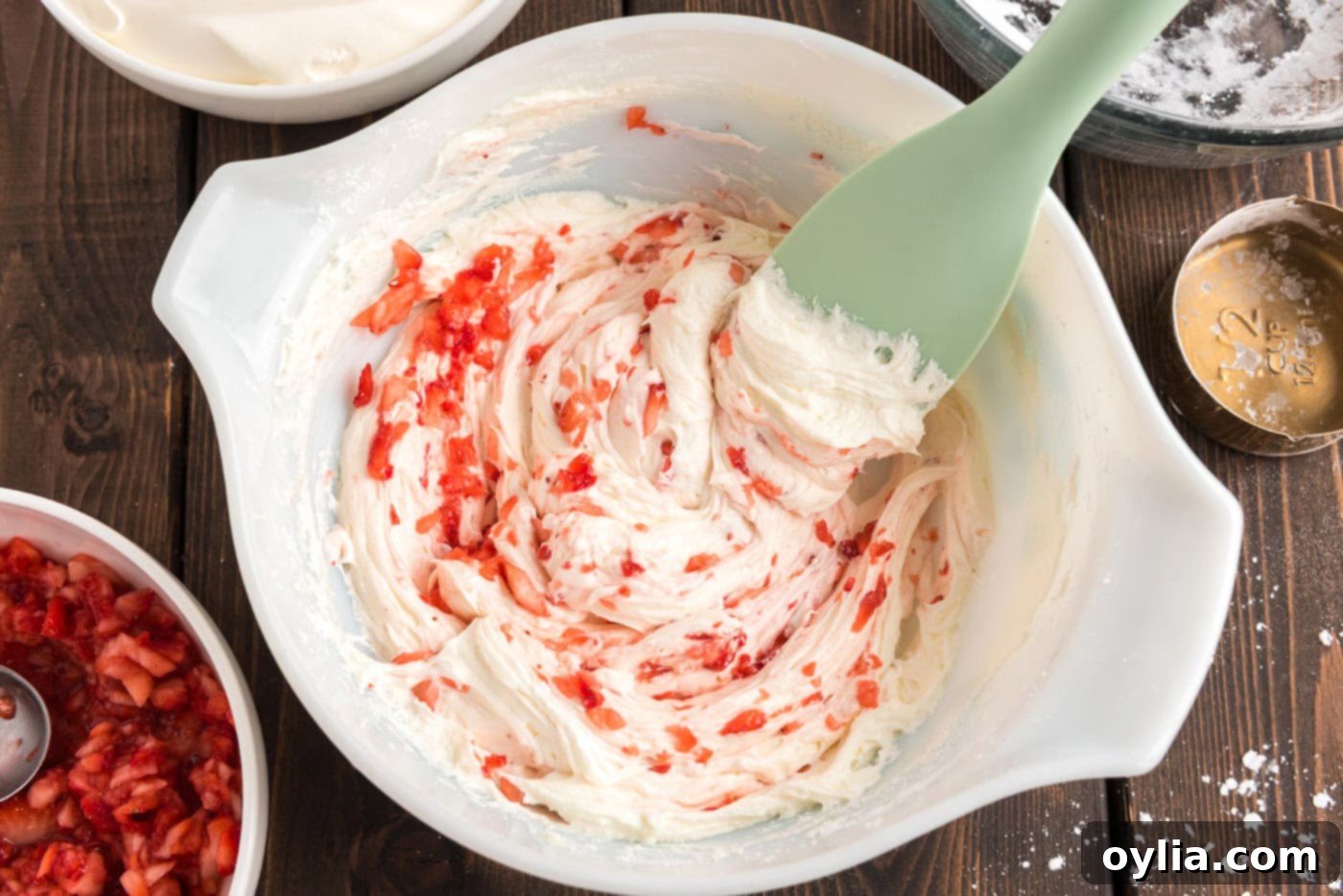 Strawberry and cream cheese mixture in a mixing bowl