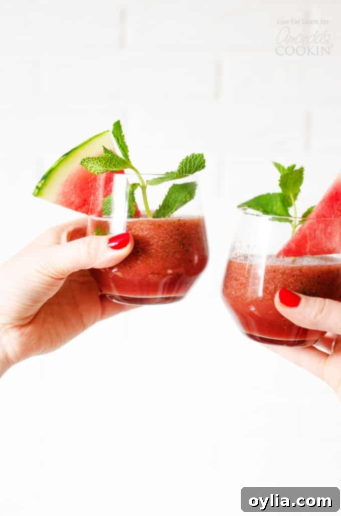 Refreshing Mint Watermelon Smoothie in a glass with fresh mint leaves