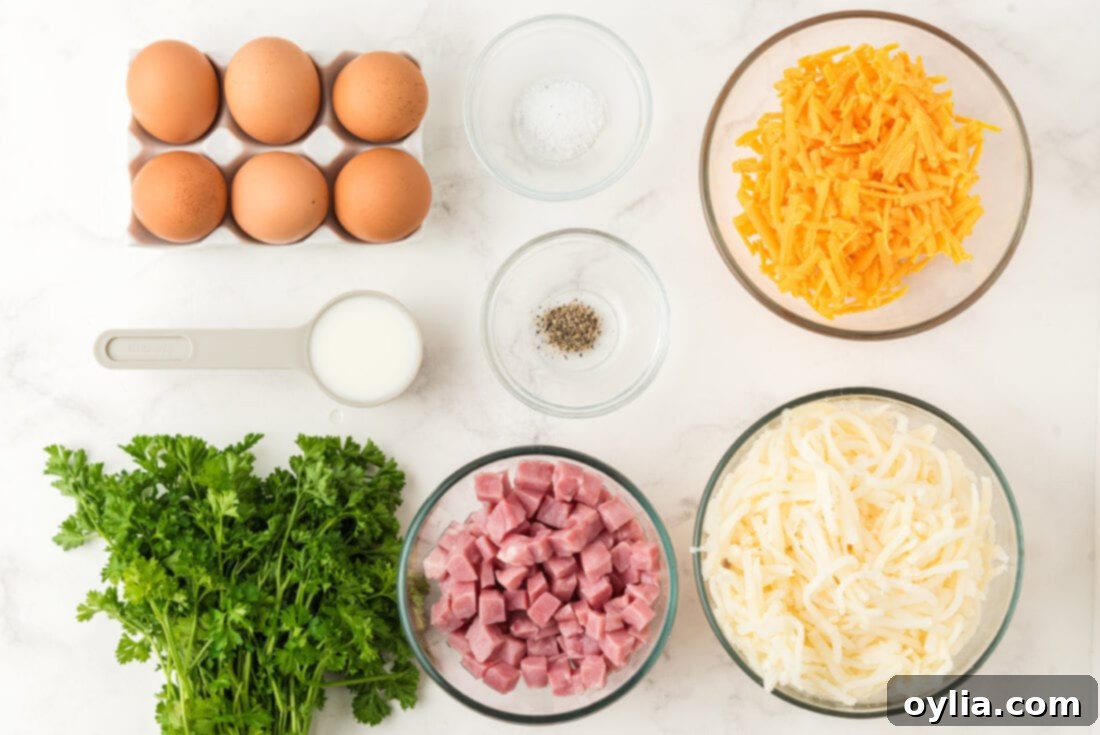 Ingredients for Breakfast casserole laid out on a wooden board: hash browns, ham, eggs, milk, cheese, and seasonings