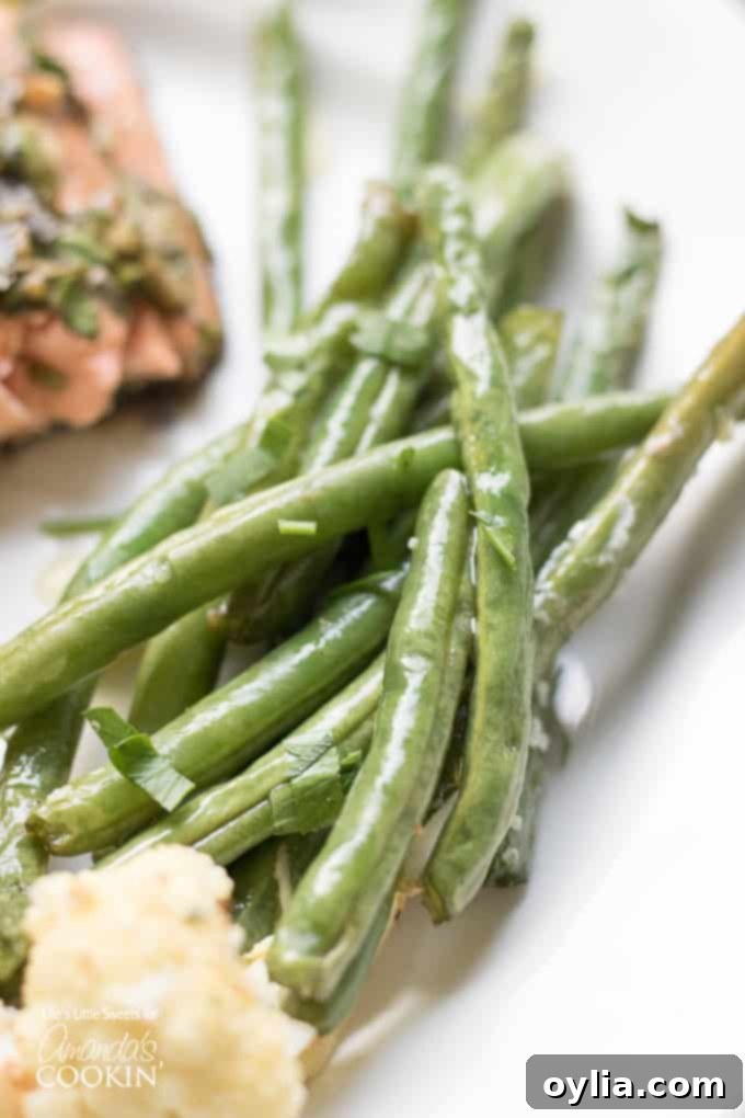 Roasted side veggies for sheet pan salmon dinner: green beans and cauliflower