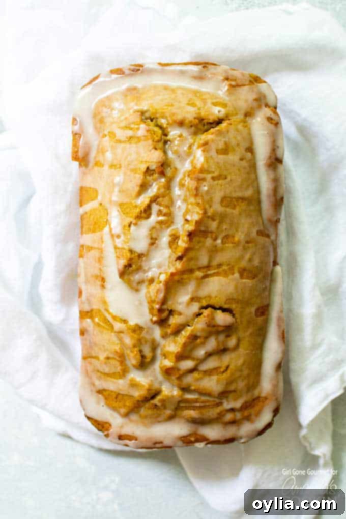 Pumpkin bread loaf with maple glaze, freshly baked and ready to serve