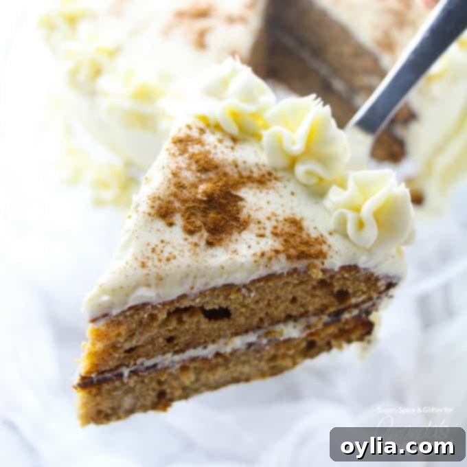 A beautiful slice of spice cake on a spatula, showcasing its moist, layered texture and creamy frosting. Perfect for a cozy fall treat.