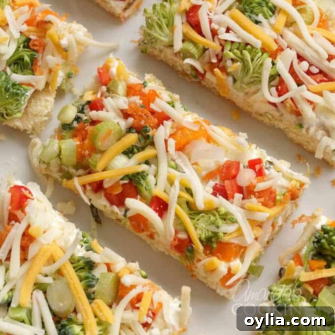 fresh veggies and cheese on cream cheese and crescent dough