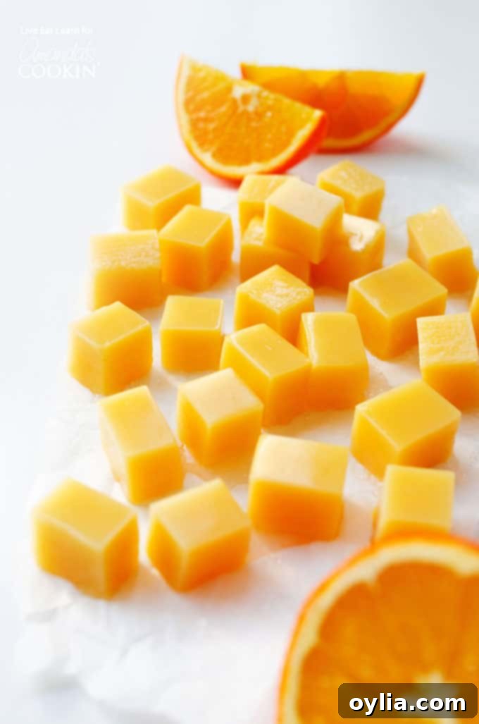 Orange creamsicle gummies with oranges, ready to be enjoyed as a homemade treat.