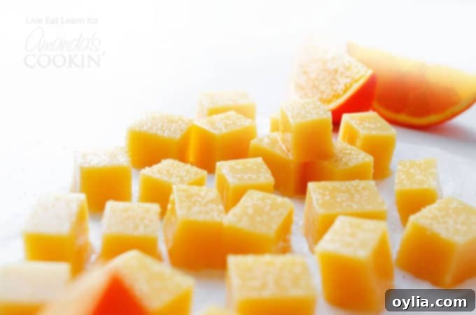 A close-up of homemade orange creamsicle gummies, showcasing their vibrant color and inviting texture.