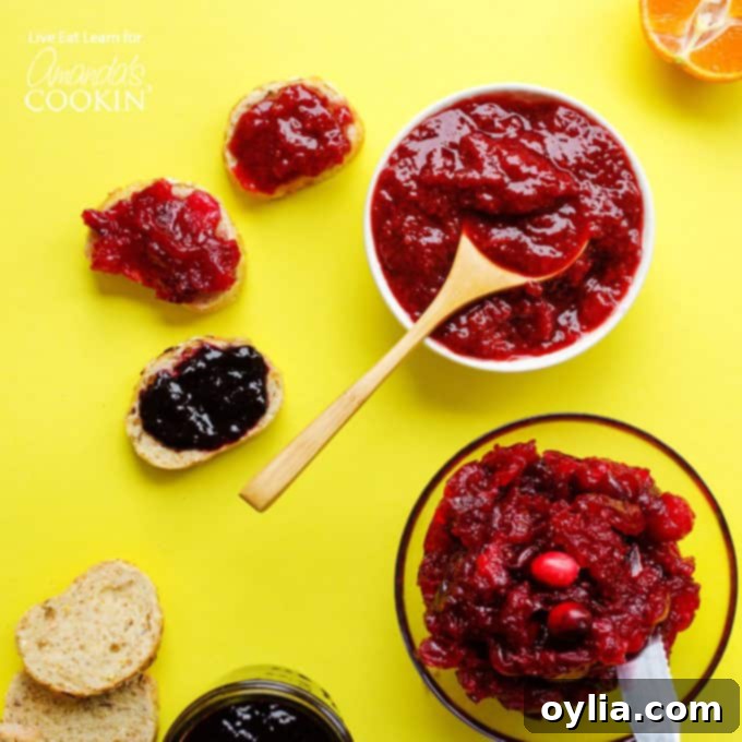 Close-up of vibrant homemade berry jam bubbling in a saucepan, demonstrating the cooking process.