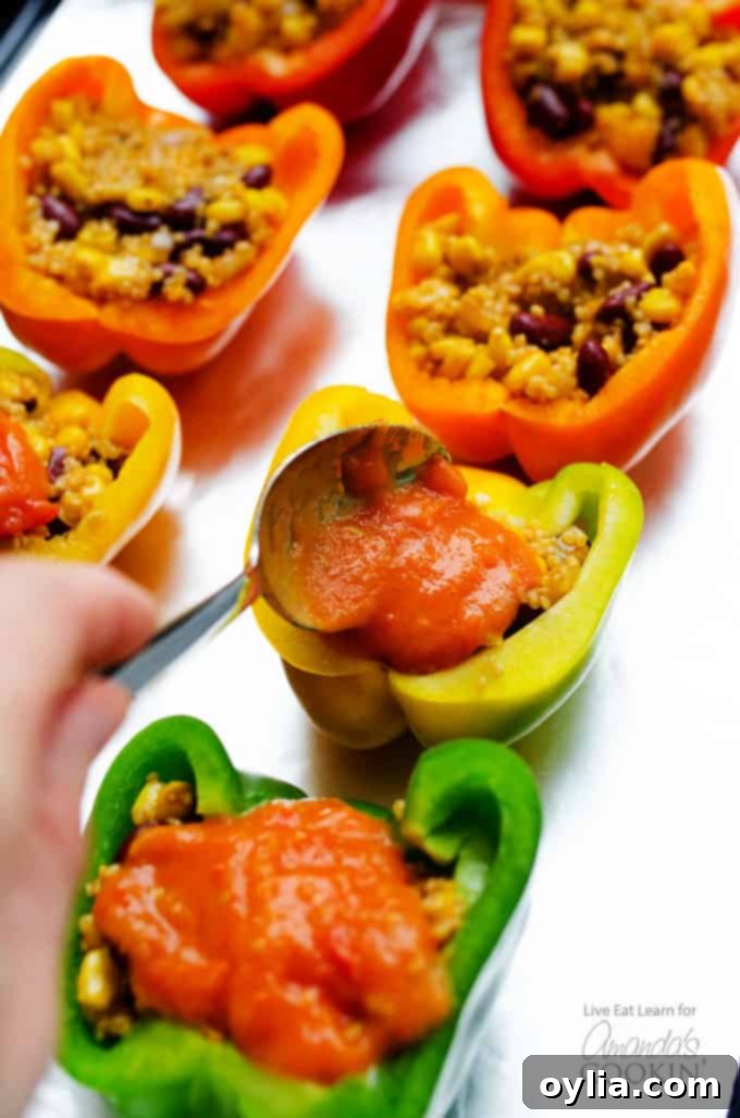Adding sauce to enchilada stuffed peppers