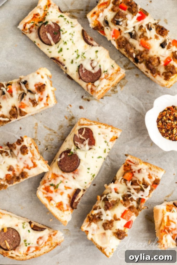 Perfectly sliced French bread pizza on a cutting board, garnished with fresh basil.