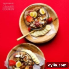 Bowl of cooked quinoa with banana slices, ready for breakfast