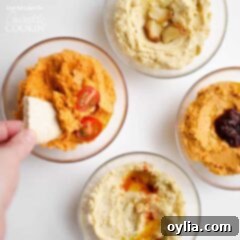 dipping pita in hummus