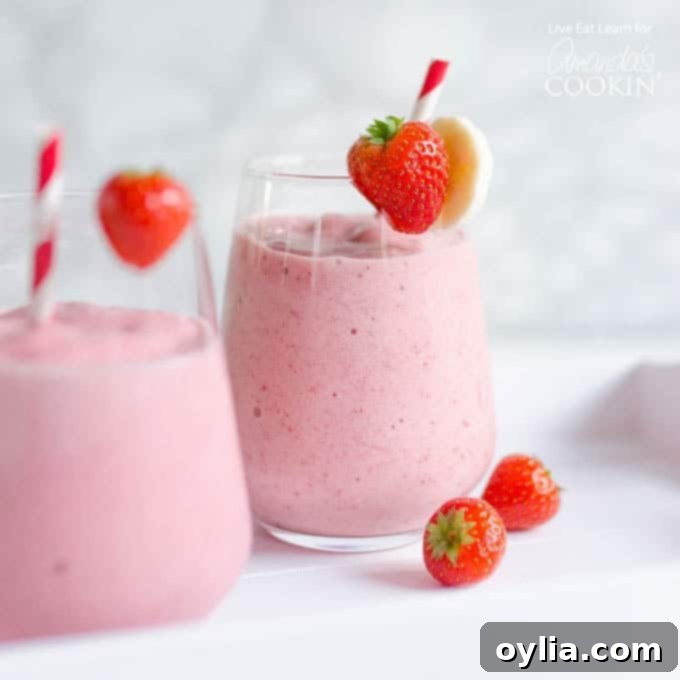 A close up of a strawberry banana smoothie