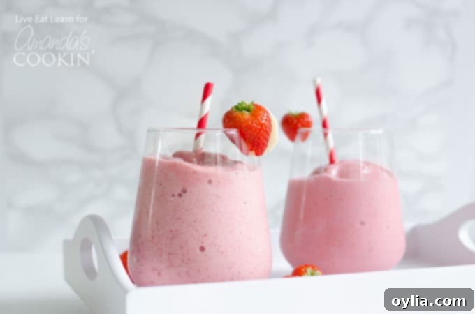 strawberry banana smoothies with strawberry garnish