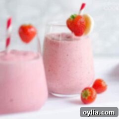 A close up of a strawberry banana smoothie