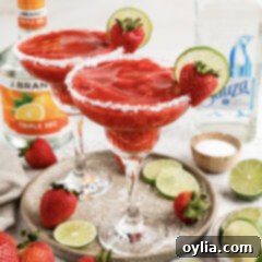 Close up photo of two Strawberry Margaritas on a serving platter