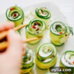 Hellenic Sushi Rolls 6 picking up cucumber sushi with chopsticks