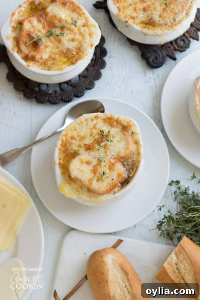 An inviting overhead shot of a bowl of French Onion Soup, featuring the melted cheese and a spoon, ready to be enjoyed.