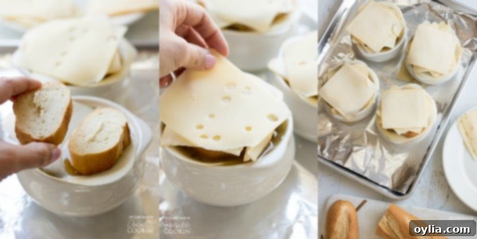 Hands carefully placing baguette slices and cheese on top of French Onion Soup bowls before broiling to create a golden crust.