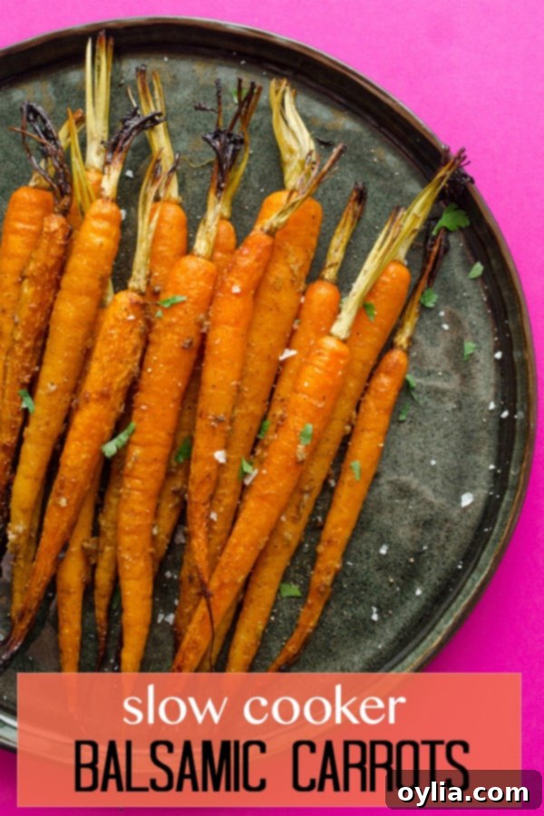 Sweet and Tangy Slow Cooker Balsamic Carrots 6 carrots on a black plate, a great side dish