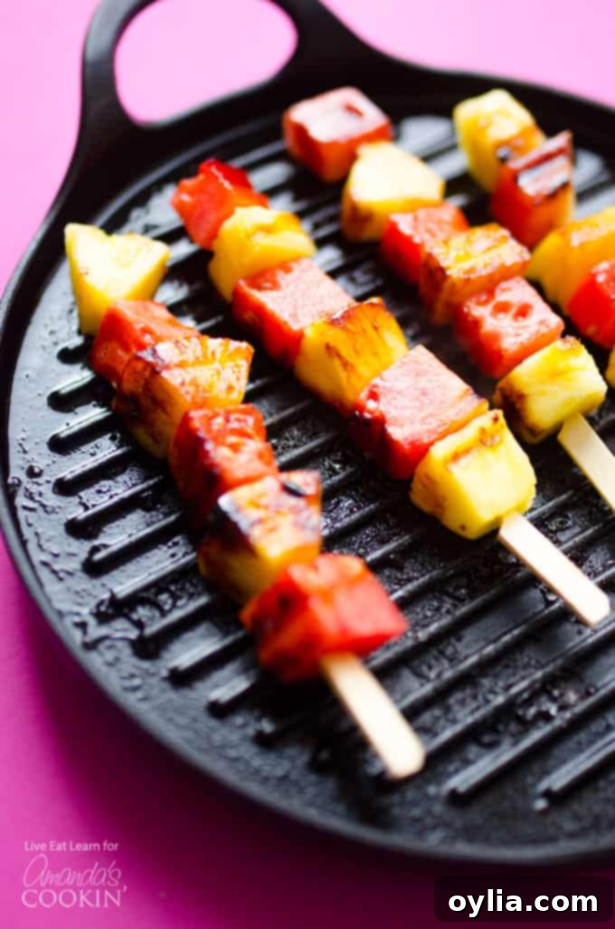 Watermelon Pineapple Skewers on a grill pan, beautifully caramelized