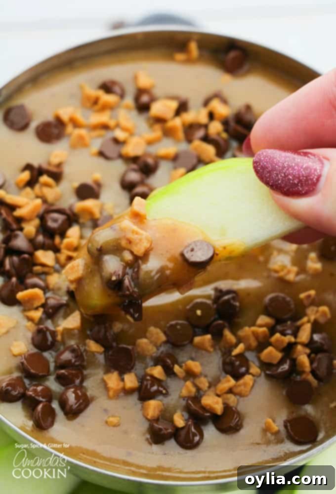 Dipping an apple slice into homemade caramel dip