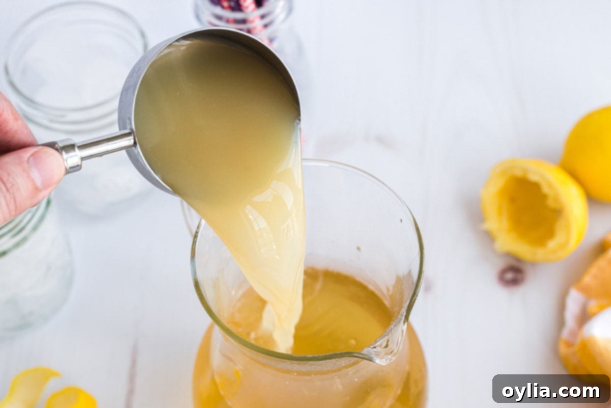 Tennessee Zest 4 Pouring lemon juice into a pitcher