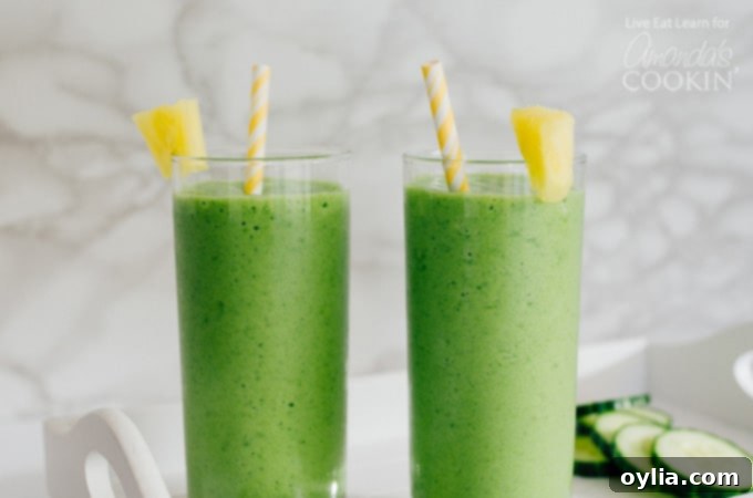 Cucumber tropical smoothies with pineapple wedge