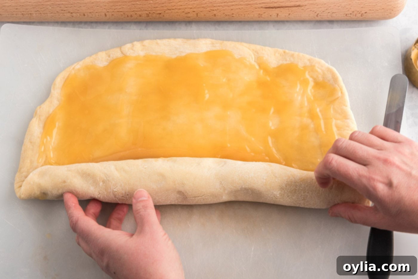 rolling lemon rolls into a log
