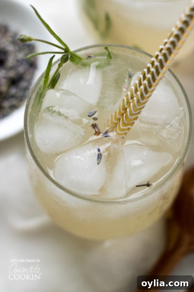 overhead view of lemonade in glass with lavender leaves
