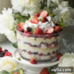 berry trifle with flowers in the background