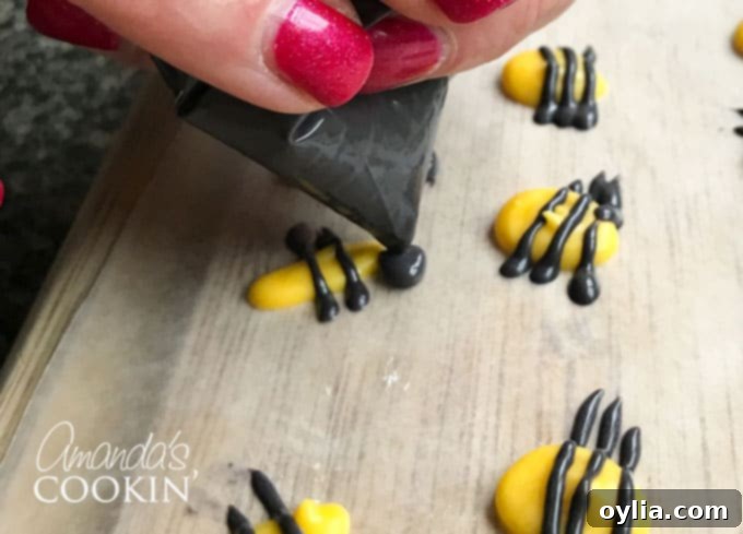 Add the bee head with black candy melts