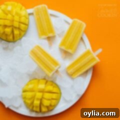 Mango Yogurt popsicles on a plate of ice, ready to be enjoyed