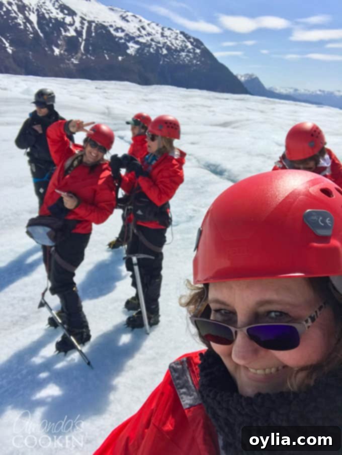 Mendenhall Glacier helicopter tour, showcasing the vast expanse of the glacier from above with a helicopter visible