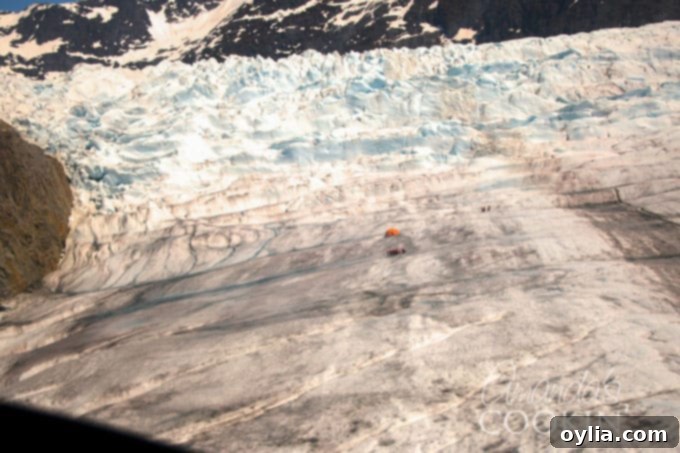 Breathtaking aerial view of the Mendenhall Glacier and surrounding Alaskan landscape from a helicopter