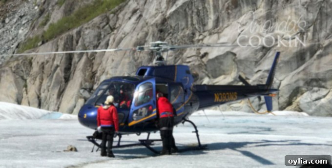 The vast expanse of Mendenhall Glacier with mountains in the background, a view from the helicopter tour