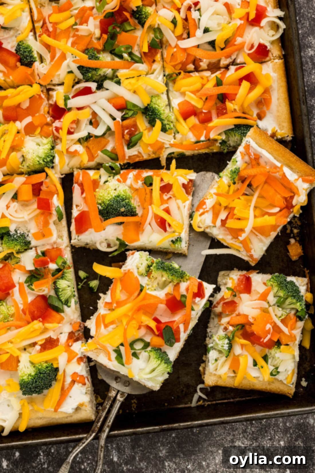 Close up photo of Appetizer Veggie Pizza slices on a pan