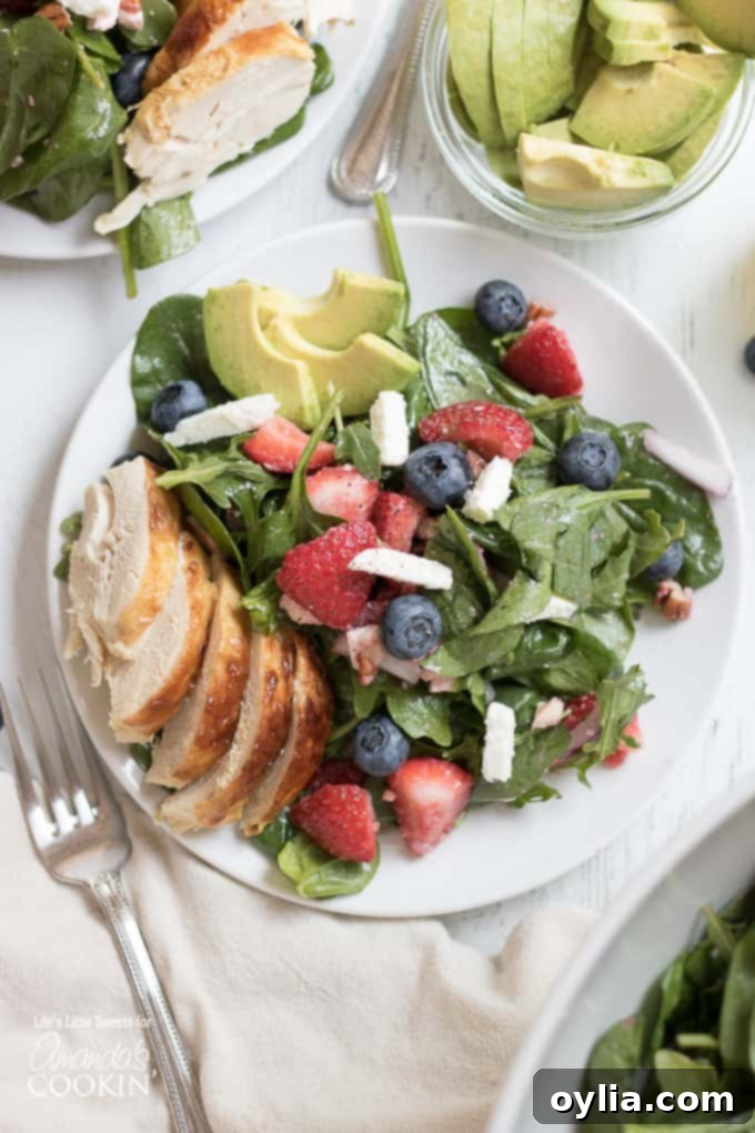 Strawberry Salad with blueberries, avocado, and chicken.