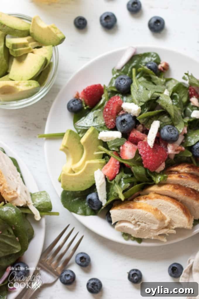 Strawberry salad with blueberries, avocado and chicken.