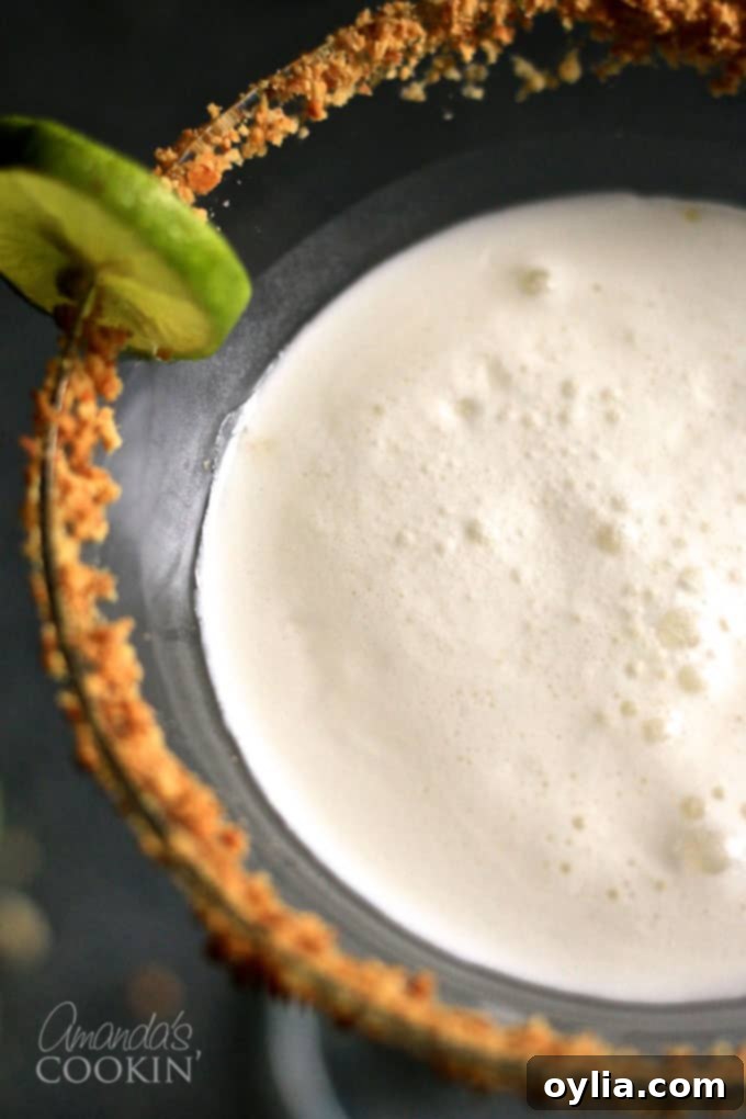 Overhead shot of a Key Lime Pie Martini, garnished with a lime slice.