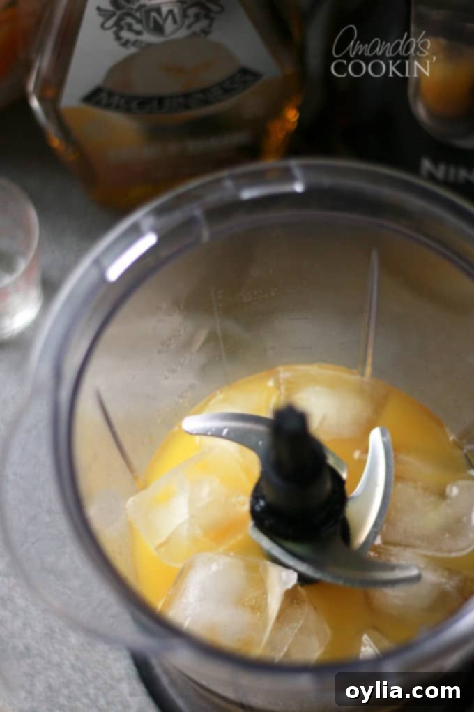 blender with ice and cocktail ingredients
