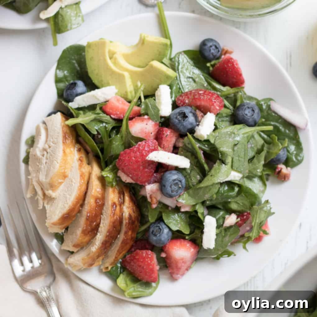Refreshing Strawberry Salad with greens and a light dressing.