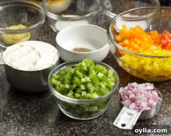 Assortment of neatly chopped vegetables in small dishes, prepared using a chop wizard.