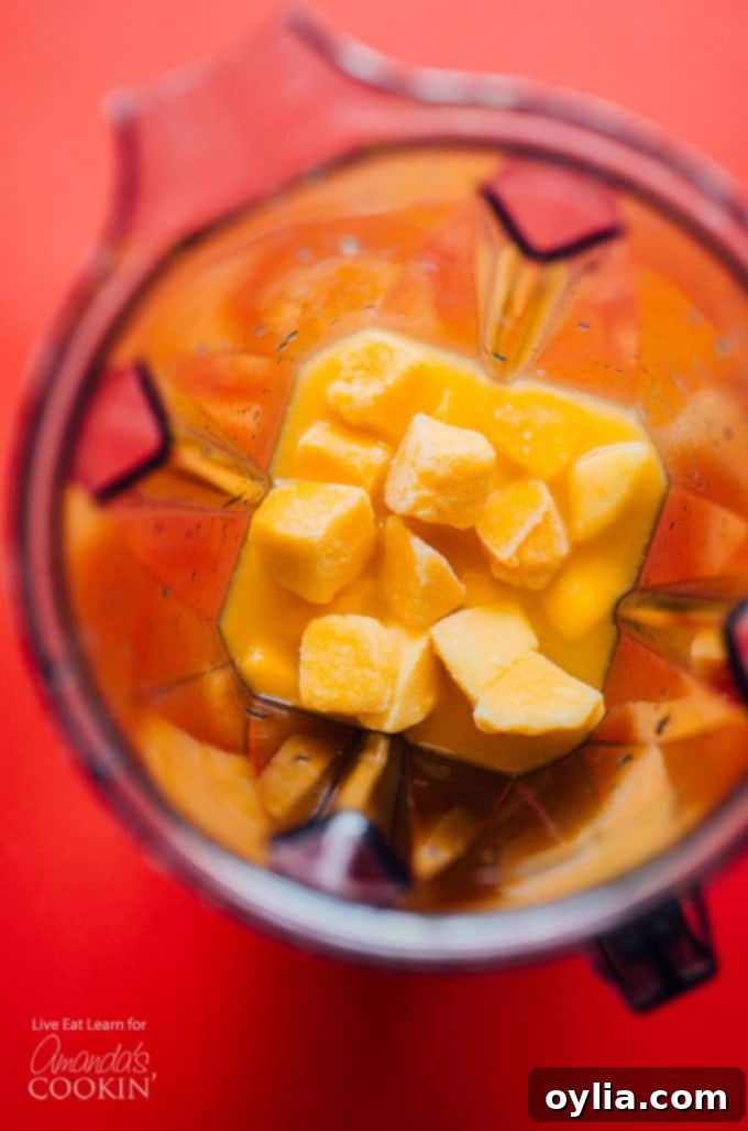 Frozen mangos in a blender