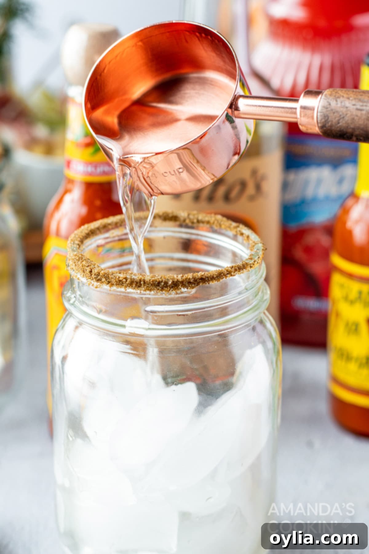 adding vodka to glass