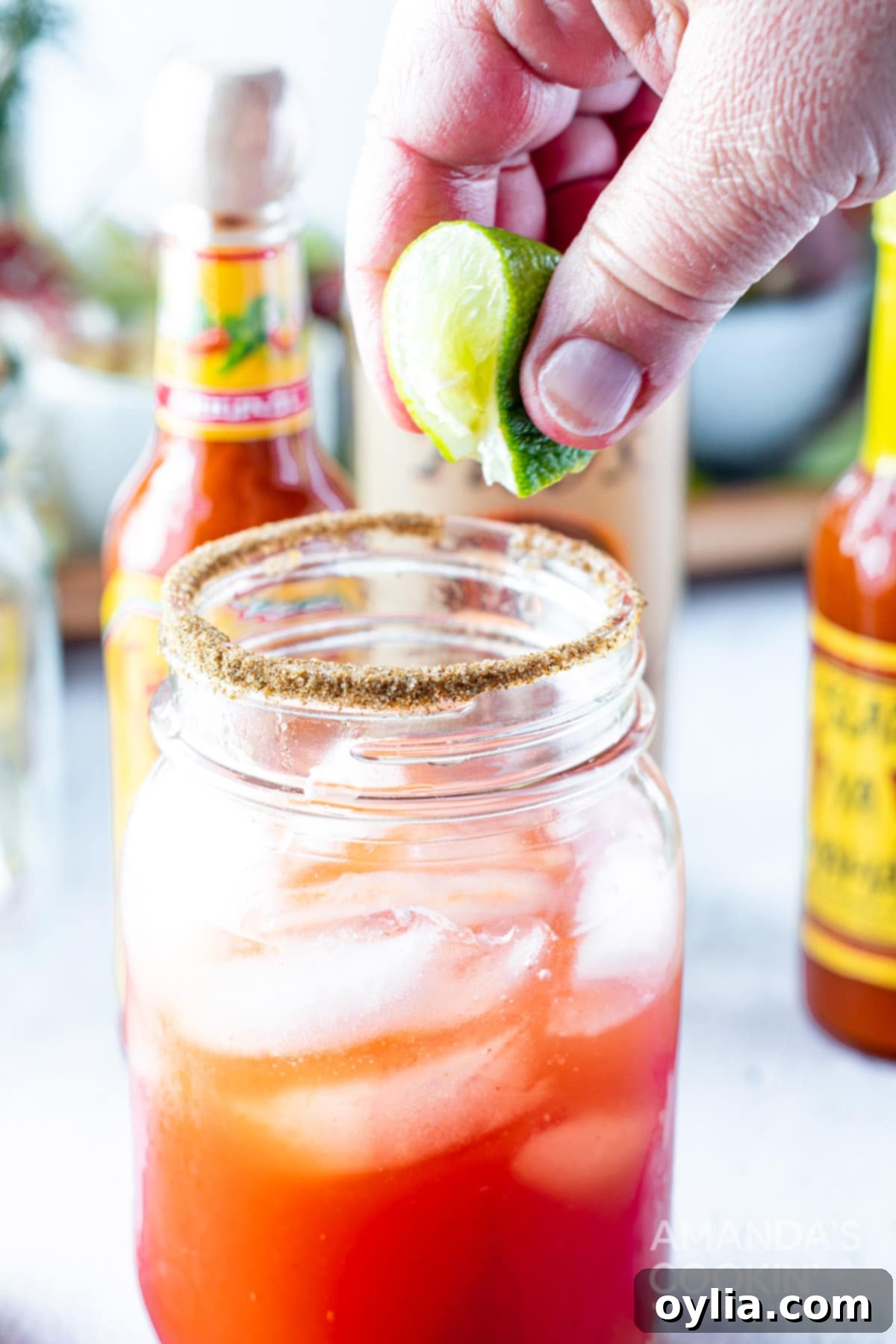 squeezing lime over glass