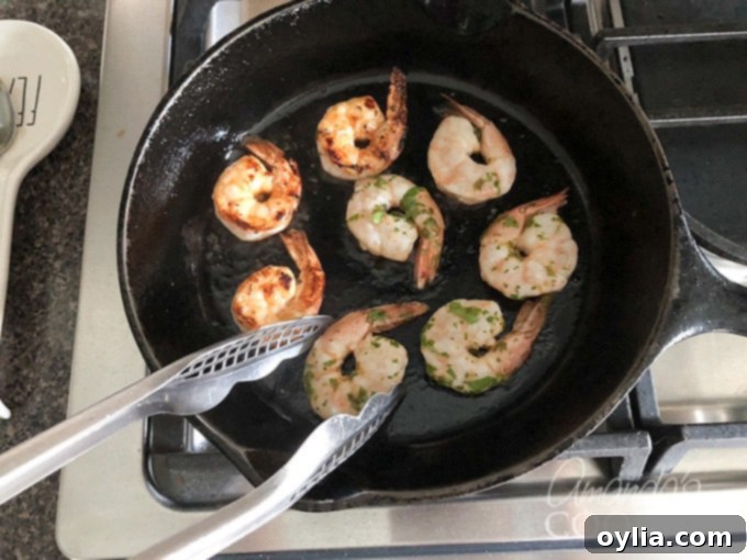 turning shrimp in skillet