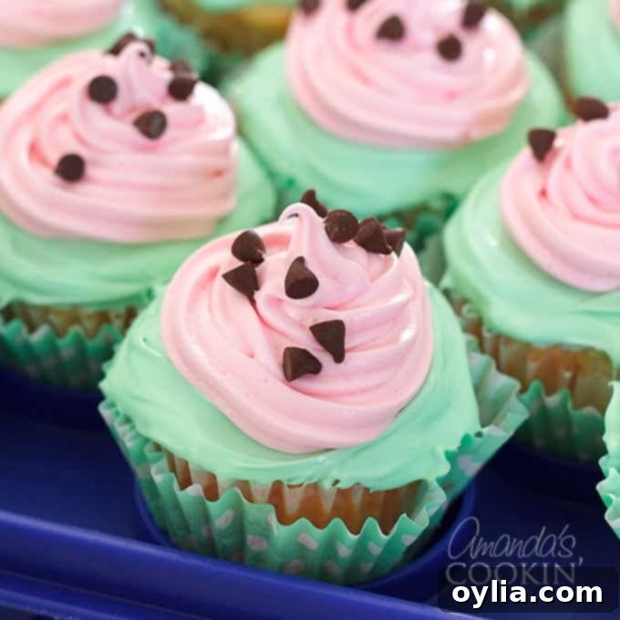 Close-up of a watermelon poke cupcake showing the Jello filling