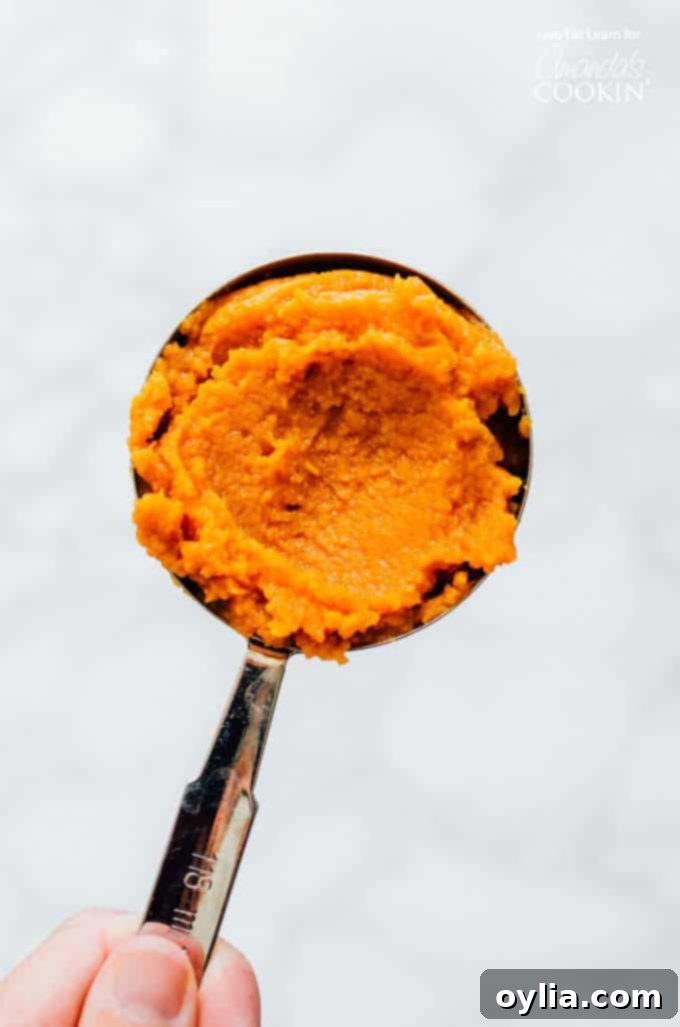 Pumpkin puree in a measuring cup