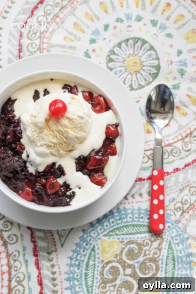 Warm cherry cobbler cooking in a slow cooker